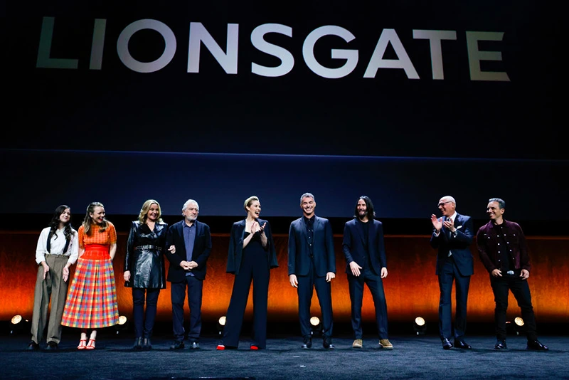LAS VEGAS, NEVADA - APRIL 28: L-R) Abby Ryder Fortson, Rachel McAdams, Kim Cattrall, Robert De Niro, Leslie Bibb, Chad Stahelski, Keanu Reeves, Joe Drake and Sebastian Maniscalco speak onstage during CinemaCon 2022 - Lionsgate Invites You to An Exclusive Presentation of its Upcoming Slate at The Colosseum at Caesars Palace during CinemaCon, the official convention of the National Association of Theatre Owners, on April 28, 2022, in Las Vegas, Nevada. (Photo by Frazer Harrison/Getty Images for for CinemaCon)