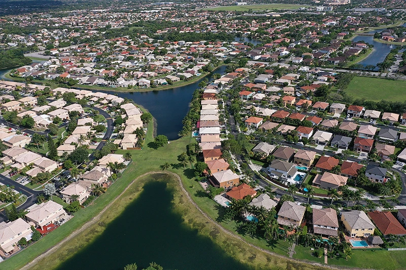 Housing Markets Shows Signs Of Cooling Off
MIAMI, FLORIDA - MAY 10: In an aerial view, single family homes are shown in a residential neighborhood on May 10, 2022 in Miami, Florida. New published data has hinted at improvement in the supply of homes for sale as April's numbers show inventory down 12 percent from the same month last year, the smallests yearly decline since the end of 2019. (Photo by Joe Raedle/Getty Images)