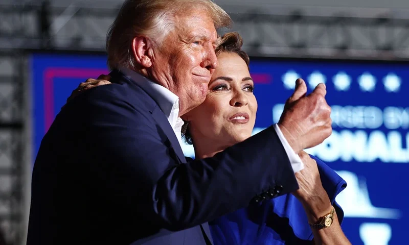 MESA, ARIZONA - OCTOBER 09: Former U.S. President Donald Trump embraces Arizona Republican gubernatorial nominee Kari Lake at a campaign rally at Legacy Sports USA on October 09, 2022 in Mesa, Arizona. Trump was stumping for Arizona GOP candidates ahead of the midterm election on November 8. (Photo by Mario Tama/Getty Images)