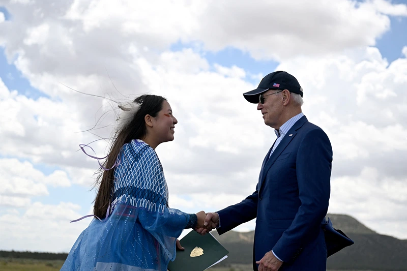 US-POLITICS-ENVIRONMENT-BIDEN
Maya Tilousi, member of the Hopi Tribe, Havasupai Tribe of Grand Canyon, and the Cheyanne and Arapaho Tribes, shakes hands with US President Joe Biden at Red Butte Airfield, 25 miles (40kms) south of Tusayan, Arizona, on August 8, 2023. Biden announced he is putting the brakes on uranium mining around the Grand Canyon. Biden will give an area of nearly one million acres (404,686 hectares) "national monument" status. (Photo by Jim WATSON / AFP) (Photo by JIM WATSON/AFP via Getty Images)