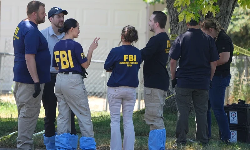 Suspect Shot In FBI Raid Reportedly Connected To President Biden Threats In Utah PROVO, UTAH - AUGUST 9: FBI officials and other law enforcement officers stand outside the home of Craig Robertson who was shot and killed by the FBI in a raid on his home this morning on August 9, 2023 in Provo, Utah. The FBI was investigating alleged threats by Robertson to President Biden who is visiting Salt Lake City today and tomorrow. (Photo by George Frey/Getty Images)