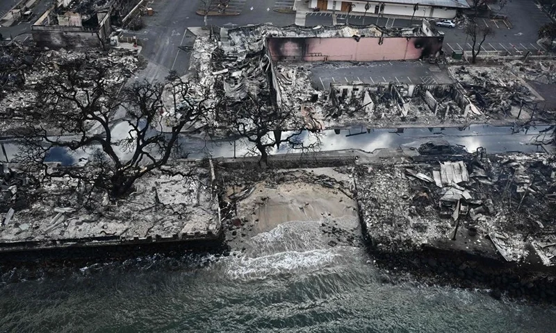 TOPSHOT - An aerial image taken on August 10, 2023 shows destroyed homes and buildings on the waterfront burned to the ground in Lahaina in the aftermath of wildfires in western Maui, Hawaii. At least 36 people have died after a fast-moving wildfire turned Lahaina to ashes, officials said August 9, 2023 as visitors asked to leave the island of Maui found themselves stranded at the airport. The fires began burning early August 8, scorching thousands of acres and putting homes, businesses and 35,000 lives at risk on Maui, the Hawaii Emergency Management Agency said in a statement. (Photo by Patrick T. Fallon / AFP) (Photo by PATRICK T. FALLON/AFP via Getty Images)