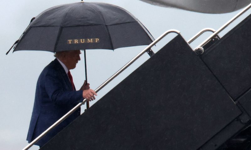 Former U.S. President Donald Trump boards his plane at Reagan National Airport following an arraignment in Washington, D.C. federal court on August 3, 2023 in Arlington, Virginia. Trump pleaded not guilty to four felony criminal charges during his arraignment this afternoon after being indicted for his alleged efforts to overturn the 2020 election. (Photo by Win McNamee/Getty Images)