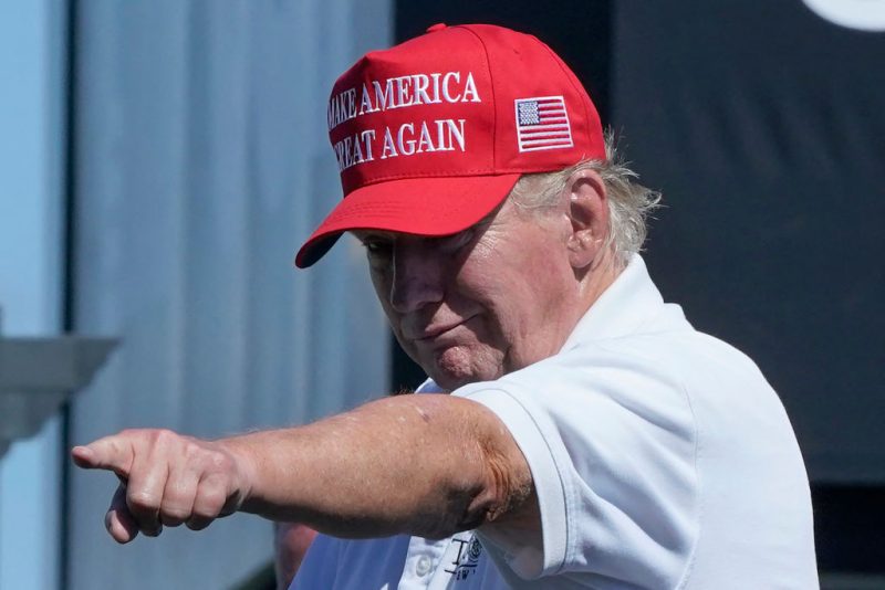 TOPSHOT - Former US President Donald Trump points at the crowd as he attends Round 3 of the LIV Golf-Bedminster 2023 at the Trump National in Bedminster, New Jersey on August 13, 2023. Donald Trump was indicted August 14, 2023 on charges of racketeering and a string of election crimes after a sprawling two-year probe into his efforts to overturn his 2020 defeat to Joe Biden in the US state of Georgia, according to a court filing.