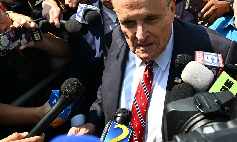 US-JUSTICE-POLITICS-TRUMP Former New York City Mayor and attorney of former US President Donald Trump, Rudy Giuliani, speaks to members of the media after being booked, outside the Fulton County Jail in Atlanta, Georgia, on August 23, 2023. Giuliani, former US President Donald Trump, and 17 others were given until August 25, 2023 to surrender at the courthouse after being indicted on 41 counts related to their efforts to overturn the 2020 US Presidential election. (Photo by CHANDAN KHANNA / AFP) (Photo by CHANDAN KHANNA/AFP via Getty Images)