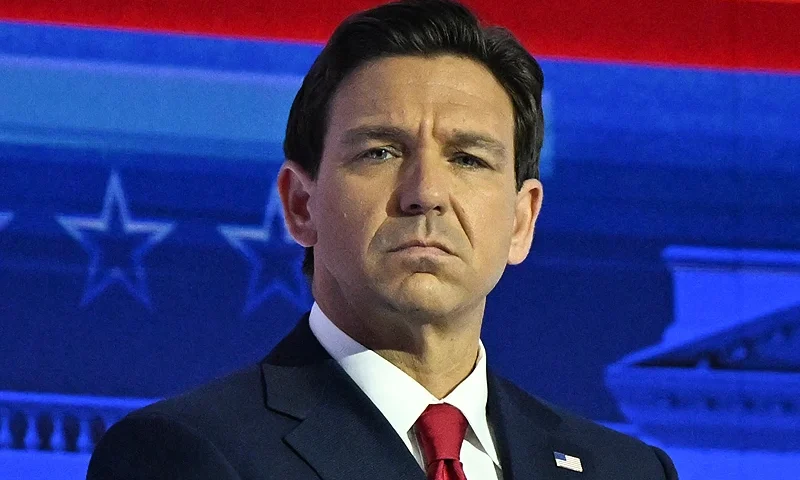 Florida Governor Ron DeSantis places his hand on his heart as the US national anthem is sung during the first Republican Presidential primary debate at the Fiserv Forum in Milwaukee, Wisconsin, on August 23, 2023. (Photo by Pedro Ugarte / AFP) (Photo by PEDRO UGARTE/AFP via Getty Images)