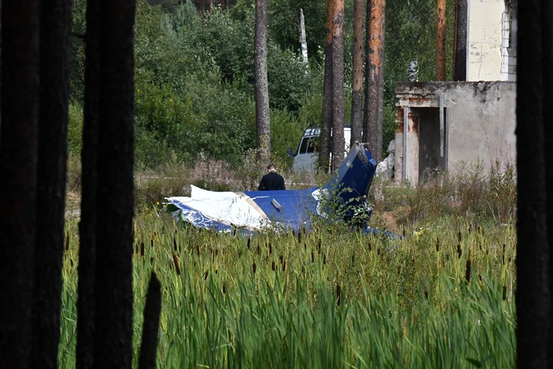  A law enforcement officer works at the site of a plane crash near the village of Kuzhenkino, Tver region, on August 24, 2023. Russian state-run news agencies on August 23, 2023 said that Yevgeny Prigozhin, the head of the Wagner group that led a mutiny against Russia's army in June, was on the list of passengers of a plane that crashed near the village of Kuzhenkino in the Tver region. (Photo by Olga MALTSEVA / AFP) (Photo by OLGA MALTSEVA/AFP via Getty Images)