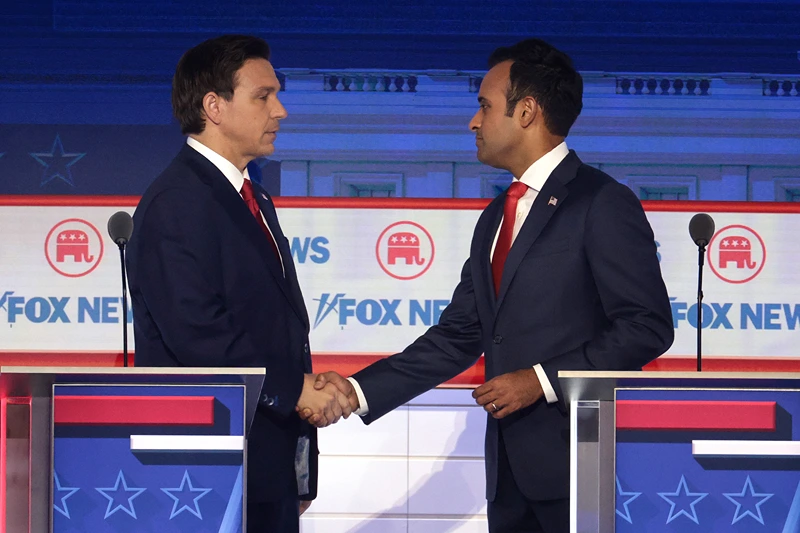 Presidential Hopefuls Square Off In First GOP Debate
MILWAUKEE, WISCONSIN - AUGUST 23: Republican presidential candidates, Florida Gov. Ron DeSantis (L) and Vivek Ramaswamy shake hands during the first debate of the GOP primary season hosted by FOX News at the Fiserv Forum on August 23, 2023 in Milwaukee, Wisconsin. Eight presidential hopefuls squared off in the first Republican debate as former U.S. President Donald Trump, currently facing indictments in four locations, declined to participate in the event. (Photo by Win McNamee/Getty Images)