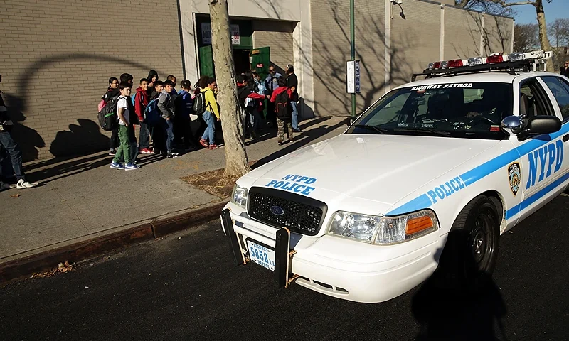 Brooklyn School Evacuated After Bomb Threat NEW YORK, NY - DECEMBER 15: A police car is viewed in front of the Peter Rouget Brooklyn middle school as children are let back in following reports of a bomb threat on December 15, 2015 in New York City. New York City received the same bomb threat that shut down more than 900 Los Angeles schools on Tuesday. New York Police Commissioner Bill Bratton said the NYPD deemed the threat a "hoax" and has kept schools open. (Photo by Spencer Platt/Getty Images)