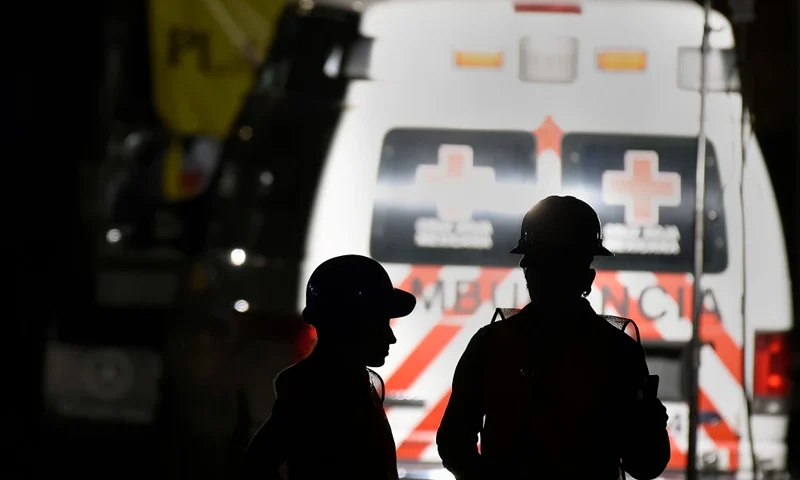 Volunteer rescue workers stand behind an ambulance as they help search for survivors in the rubble of a building destroyed by the earthquake in Mexico City, in the early hours of the morning on September 24, 2017, five days after the powerful quake that hit central Mexico. A strong 6.1 magnitude quake shook Mexico on Saturday, causing panic in traumatized Mexico City, where rescuers trying to free people trapped from this week's earlier earthquake had to temporarily suspend work. / AFP PHOTO / ALFREDO ESTRELLA (Photo credit should read ALFREDO ESTRELLA/AFP via Getty Images)