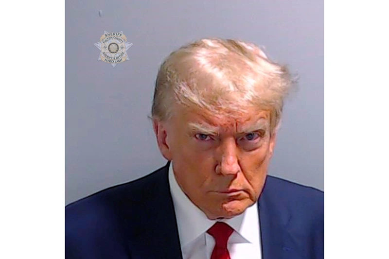 This booking photo provided by the Fulton County Sheriff’s Office shows former President Donald Trump on Thursday, Aug. 24, 2023, after he surrendered and was booked at the Fulton County Jail in Atlanta. Trump is accused by Fulton County District Attorney Fani Willis of attempting to subvert the will of Georgia voters in a bid to keep Joe Biden out of the White House. (Fulton County Sheriff’s Office via AP)