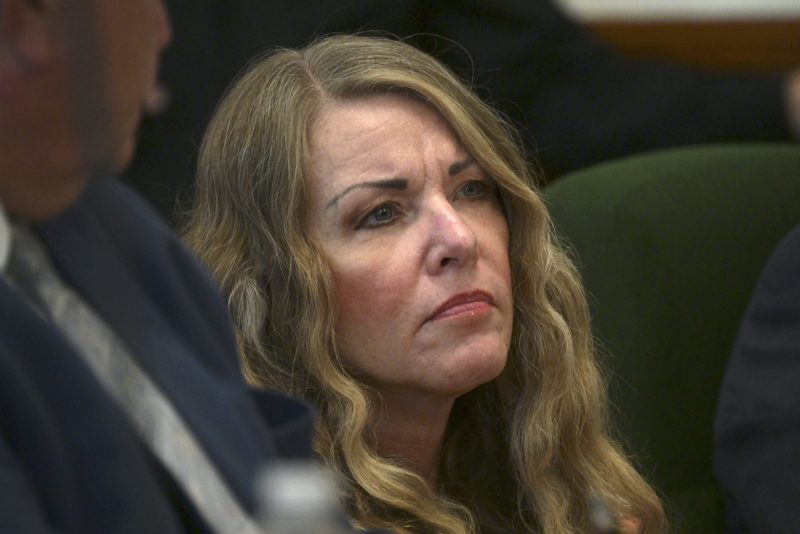 FILE - Lori Vallow Daybell sits during her sentencing hearing at the Fremont County Courthouse in St. Anthony, Idaho, Monday, July 31, 2023. Vallow Daybell, who was sentenced to life in prison in the murders of her two youngest children and a woman she saw as a romantic rival is appealing her conviction to the Idaho Supreme Court. Attorneys for Vallow Daybell filed a notice of appeal saying she will ask the high court to consider several issues, including whether an eastern Idaho judge may have wrongly found her competent to stand trial after she spent 10 months in a mental hospital. (Tony Blakeslee/EastIdahoNews.com via AP, Pool, File)