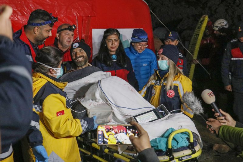 American researcher Mark Dickey, center, talks to journalists after being pulled out of Morca cave near Anamur, south Turkey, on early Tuesday, Sept. 12, 2023, more than a week after he became seriously ill 1,000 meters (more than 3,000 feet) below its entrance. Teams from across Europe had rushed to Morca cave in southern Turkey's Taurus Mountains to aid Dickey, a 40-year-old experienced caver who became seriously ill on Sept. 2 with stomach bleeding. (Suleyman Cenk Idaye/IHA via AP)