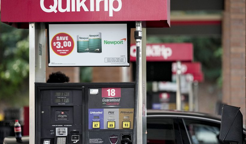 A person pumps gas, Tuesday, Sept. 12, 2023, in Marietta, Ga. Georgia's governor Brian Kemp is suspending state taxes on gasoline and diesel fuel, declaring a legal emergency over higher prices, Tuesday. (AP Photo/Mike Stewart)
