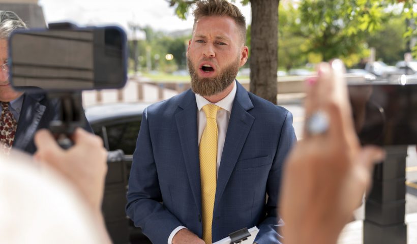 Infowars host Owen Shroyer, speaks to reporters outside the E. Barrett Prettyman U.S. Federal Courthouse, Tuesday, Sept. 12, 2023 in Washington. Shroyer was sentenced on Tuesday to two months behind bars for joining the mob's riot at the U.S. Capitol. Prosecutors said Shroyer “helped create" Jan. 6, 2021, by spewing violent rhetoric and spreading baseless claims of election fraud to hundreds of thousands of viewers. (AP Photo/Jose Luis Magana)