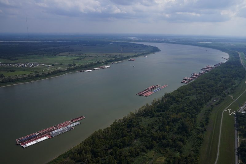 In this aerial photo, barges are seen moored during low water levels on the Mississippi River between Baton Rouge, La., and Reserve, La. in Livingston Parish, La., Thursday, Sept. 14, 2023. (AP Photo/Gerald Herbert)