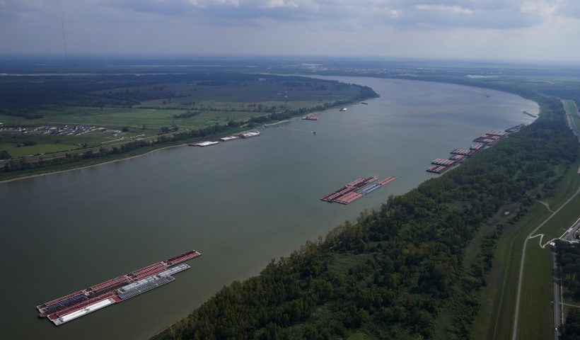 In this aerial photo, barges are seen moored during low water levels on the Mississippi River between Baton Rouge, La., and Reserve, La. in Livingston Parish, La., Thursday, Sept. 14, 2023. (AP Photo/Gerald Herbert)