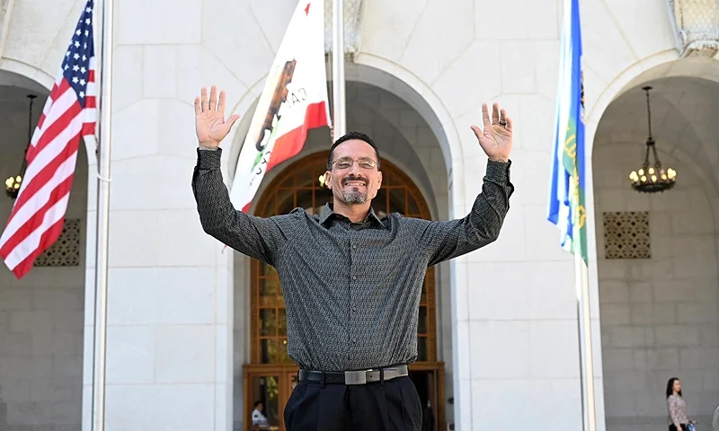 DNA Conviction Overturned In this photo provided by The Innocence Center and the California Innocence Project, Gerardo Cabanillas waves from outside the Hall of Justice in downtown Los Angeles after his release on Tuesday, Sept. 26, 2023. Cabanillas, who spent nearly 30 years in prison for kidnapping, robbery and rape, has been declared innocent and freed, Los Angeles County prosecutors announced Tuesday. DNA testing helped exonerate Cabanillas of the 1995 attack on two couples sitting in parked cars in South Gate, the county district attorney's office said in a statement. (Laurence Colletti/Legal Talk Network via AP)