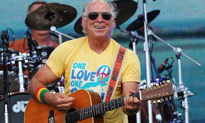 GULF SHORES, AL - JULY 11: Musician Jimmy Buffett performs onstage at Jimmy Buffett & Friends: Live from the Gulf Coast, a concert presented by CMT at on the beach on July 11, 2010 in Gulf Shores, Alabama. (Photo by Rick Diamond/Getty Images for CMT)