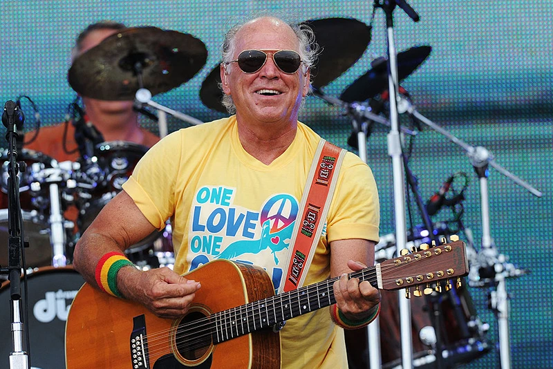 GULF SHORES, AL - JULY 11: Musician Jimmy Buffett performs onstage at Jimmy Buffett & Friends: Live from the Gulf Coast, a concert presented by CMT at on the beach on July 11, 2010 in Gulf Shores, Alabama. (Photo by Rick Diamond/Getty Images for CMT)