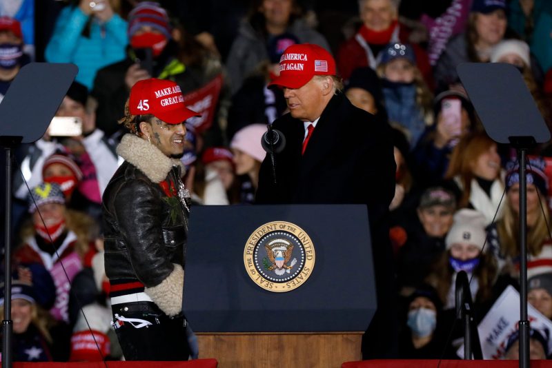 US-VOTE-TRUMP
US President Donald Trump invites rapper Lil Pump on stage during his final Make America Great Again rally of the 2020 US Presidential campaign at Gerald R. Ford International Airport on November 2, 2020, in Grand Rapids, Michigan. (Photo by JEFF KOWALSKY / AFP) (Photo by JEFF KOWALSKY/AFP via Getty Images)
