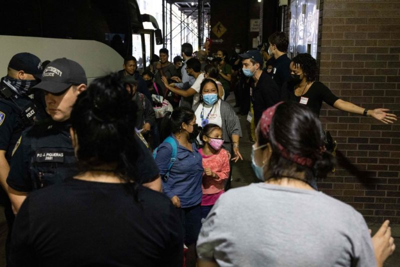 A bus carrying migrants from Texas arrives at Port Authority Bus Terminal on August 10, 2022 in New York. - Texas has sent thousands of migrants from the border state into Washington, DC, New York City, and other areas. (Photo by Yuki IWAMURA / AFP) (Photo by YUKI IWAMURA/AFP via Getty Images)