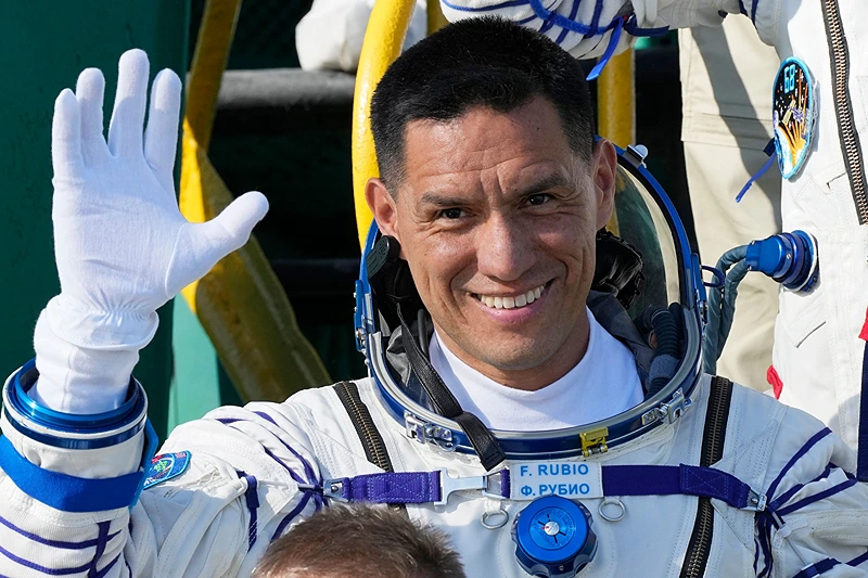 KAZAKHSTAN-RUSSIA-US-SPACE-ISS
NASA astronaut Frank Rubio, a member of the International Space Station (ISS) Expedition 68 main crew, waves as he boards the Soyuz MS-22 spacecraft prior to the launch at the Russian leased Baikonur cosmodrome in Kazakhstan on September 21, 2022. - Expedition 68 astronaut Frank Rubio of NASA, and cosmonauts Sergey Prokopyev and Dmitri Petelin of Roscosmos are scheduled to launch aboard their Soyuz MS-22 spacecraft on September 21. (Photo by Dmitry LOVETSKY / POOL / AFP) (Photo by DMITRY LOVETSKY/POOL/AFP via Getty Images)
