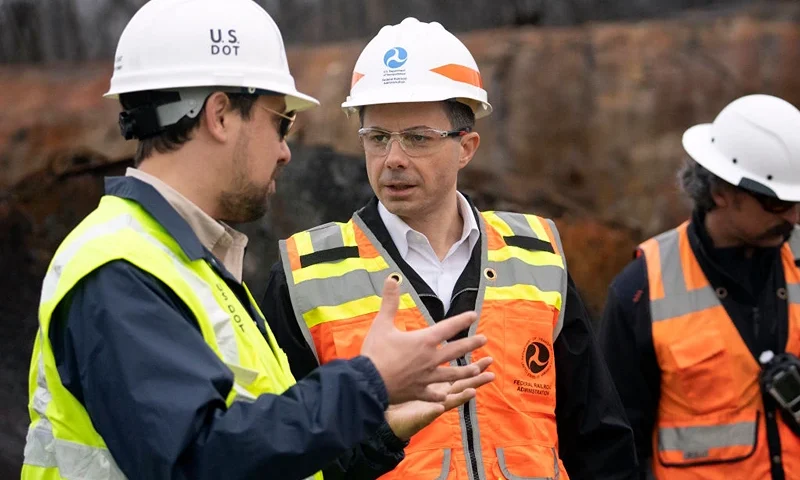 EAST PALESTINE, OH - FEBRUARY 23: U.S. Secretary of Transportation Pete Buttigieg (C) visits with Department of Transportation Investigators at the site of the derailment on February 23 2023 in East Palestine, Ohio. On February 3rd, a Norfolk Southern Railways train carrying toxic chemicals derailed causing an environmental disaster. Thousands of residents were ordered to evacuate after the area was placed under a state of emergency and temporary evacuation orders (Photo by Brooke LaValley-Pool/Getty Images)