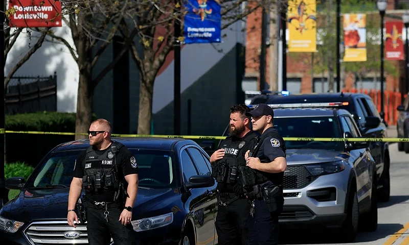 LOUISVILLE, KY - APRIL 10: Police officers gather outside the front entrance of the Old National Bank building after a gunman opened fire on April 10, 2023 in Louisville, Kentucky. According to reports, there are multiple fatalities and injuries. The shooter died at the scene. (Photo by Luke Sharrett/Getty Images)