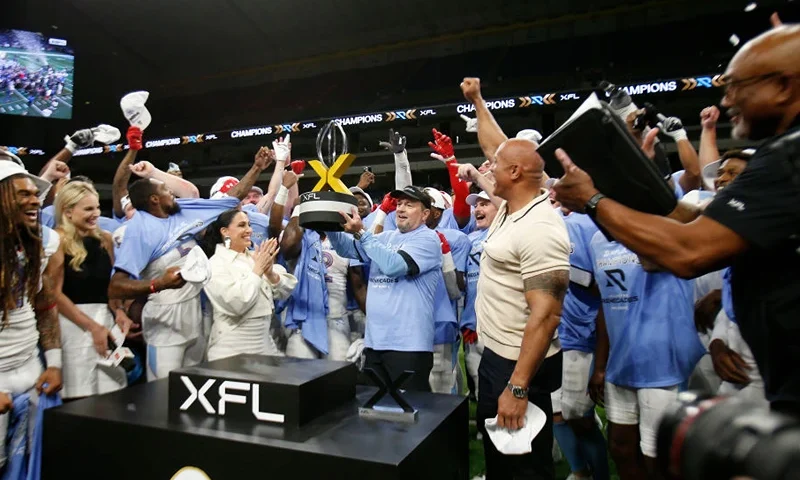 SAN ANTONIO, TX - MAY 13 : Head coach Bob Stoops of the Arlington Renegades celebrates with the trophy after defeating DC Defenders in XFL Championship game at the Alamodome on May 13 2023 in San Antonio, Texas. (Photo by Ronald Cortes/Getty Images)