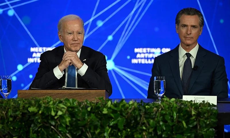 US-POLITICS-BIDEN-AI US President Joe Biden (L) and California Governor Gavin Newsom takes part in an event discussing the opportunities and risks of Artificial Intelligence at the Fairmont Hotel in San Francisco, California, on June 20, 2023. (Photo by ANDREW CABALLERO-REYNOLDS / AFP) (Photo by ANDREW CABALLERO-REYNOLDS/AFP via Getty Images)
