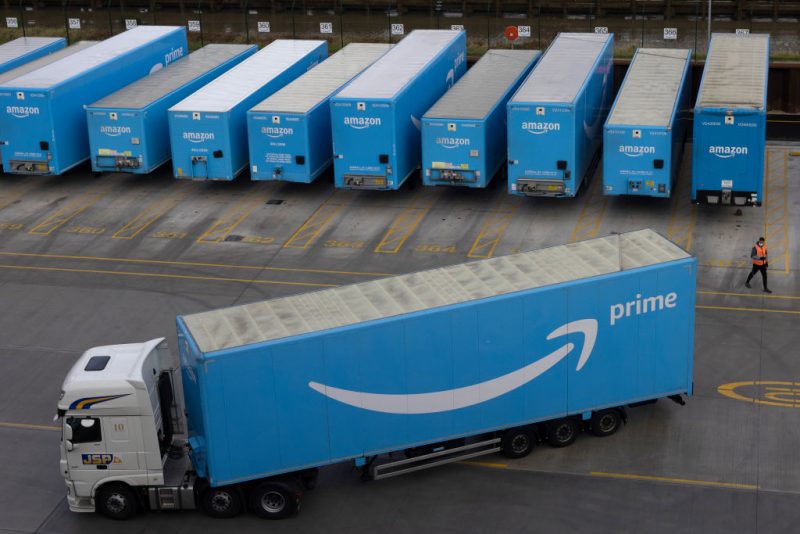 LONDON, ENGLAND - DECEMBER 13: Amazon Prime lorries are seen at the Amazon fulfilment centre on December 13, 2021 in London, England. In September, the e-commerce giant announced it would seek to fill 20,000 seasonal positions this year across the United Kingdom, bolstering its workforce in fulfilment centres, sort centres and delivery stations amid peak trading times, including Christmas. (Photo by Dan Kitwood/Getty Images)