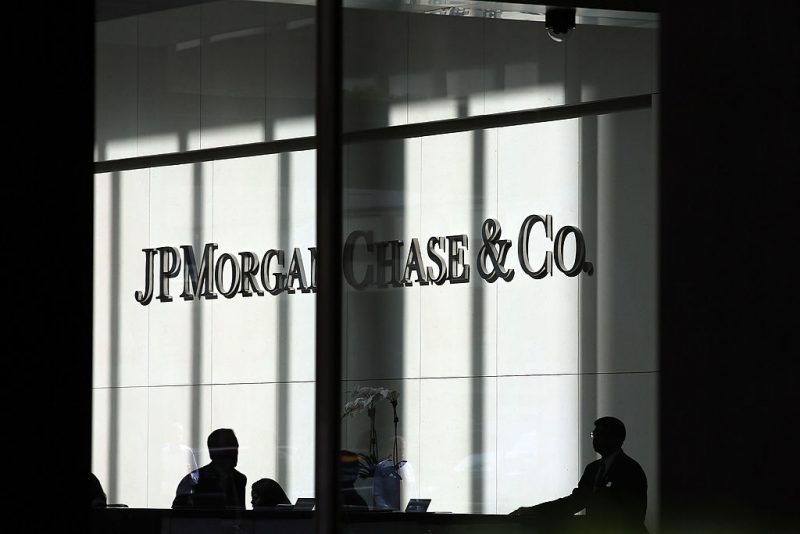 NEW YORK, NY - OCTOBER 02: People pass a sign for JPMorgan Chase & Co. at it's headquarters in Manhattan on October 2, 2012 in New York City. New York Attorney General Eric Schneiderman has filed a civil lawsuit against JPMorgan Chase alleging widespread fraud in the way that mortgages were packaged and sold to investors in the days that lead-up to the financial crisis. The allegations, which were filed in New York State Supreme Court, concern business that transpired during 2006 and 2007 at a now-defunct Bear Stearns, the failed Wall Street firm which was purchased in 2008 by JPMorgan Chase. (Photo by Spencer Platt/Getty Images)