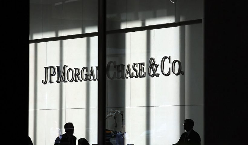 NEW YORK, NY - OCTOBER 02: People pass a sign for JPMorgan Chase & Co. at it's headquarters in Manhattan on October 2, 2012 in New York City. New York Attorney General Eric Schneiderman has filed a civil lawsuit against JPMorgan Chase alleging widespread fraud in the way that mortgages were packaged and sold to investors in the days that lead-up to the financial crisis. The allegations, which were filed in New York State Supreme Court, concern business that transpired during 2006 and 2007 at a now-defunct Bear Stearns, the failed Wall Street firm which was purchased in 2008 by JPMorgan Chase. (Photo by Spencer Platt/Getty Images)