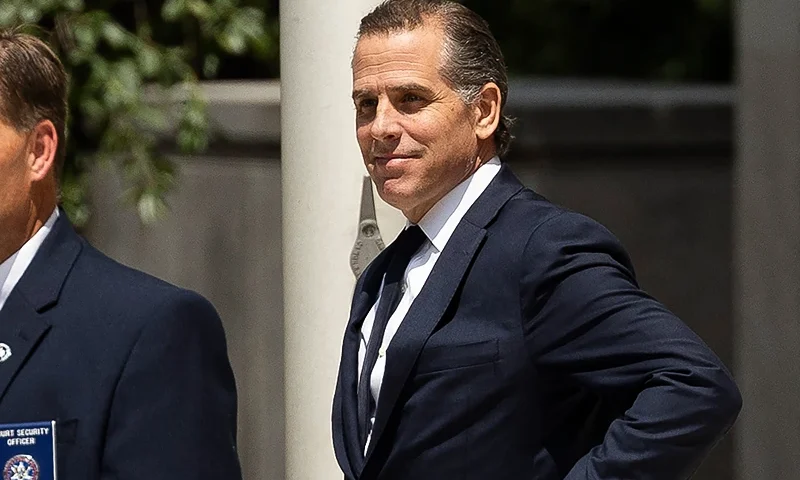 Hunter Biden (R), son of US President Joe Biden, leaves the J. Caleb Boggs Federal Building in Wilmington, Delaware, on July 26, 2023. Hunter Biden pleaded not guilty to minor tax offenses on July 26, as a deal with federal prosecutors fell apart in a Delaware court. The surprise reversal of Biden's agreement last month to settle the charges came after Judge Maryellen Noreika raised questions about the complicated deal that would also settle a separate gun charge against the president's son, US media reported. (Photo by RYAN COLLERD / AFP) (Photo by RYAN COLLERD/AFP via Getty Images)