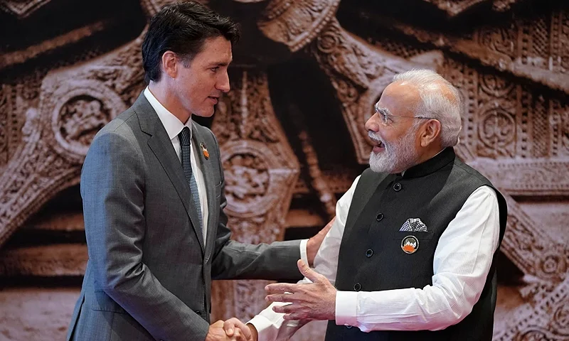India's Prime Minister Narendra Modi (R) shakes hand with Canada's Prime Minister Justin Trudeau ahead of the G20 Leaders' Summit in New Delhi on September 9, 2023. (Photo by Evan Vucci / POOL / AFP) (Photo by EVAN VUCCI/POOL/AFP via Getty Images)