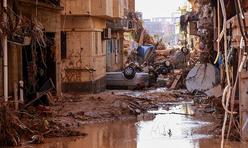 TOPSHOT - Overturned cars lay among other debris caused by flash floods in Derna, eastern Libya, on September 11, 2023. Flash floods in eastern Libya killed more than 2,300 people in the Mediterranean coastal city of Derna alone, the emergency services of the Tripoli-based government said on September 12. (Photo by AFP) (Photo by -/AFP via Getty Images)