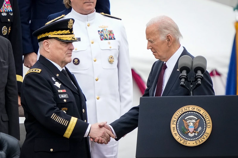 Armed Forces Farewell Tribute Held In Honor Of General Mark A. Milley
ARLINGTON, VIRGINIA - SEPTEMBER 29: U.S. President Joe Biden shakes hands with outgoing Chairman of the Joint Chiefs of Staff General Mark Milley as Biden arrives for an Armed Forces Farewell Tribute in Milley's honor at Summerall Field at Joint Base Myer-Henderson Hall September 29, 2023 in Arlington, Virginia. Incoming Chairman of the Joint Chiefs of Staff General Charles Q. Brown Jr. will be the 21st person to hold the position. (Photo by Drew Angerer/Getty Images)