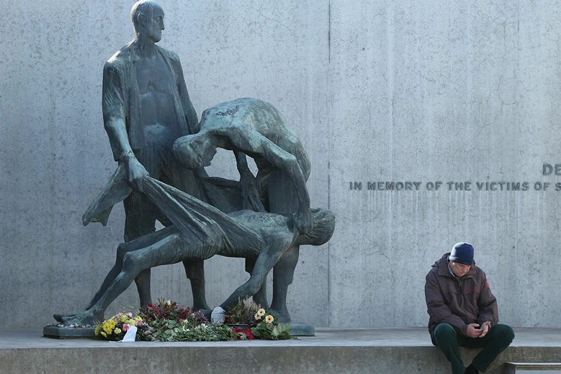 Sachsenhausen Concentration Camp Liberation 70th Anniversary Nears
ORANIENBURG, GERMANY - MARCH 18: A visitor sits next to a memorial at Station Z, where inmates were executed, their gold teeth removed and their bodies burned at the former Sachsenhausen concentration camp near Berlin on March 18, 2015 in Oranienburg, Germany. The Nazis ran Sachsenhausen from 1936-1945, using it initially for political prisoners, then later also for Soviet prisoners of war, Jews, homosexuals, Jehova's Witnesses and other victims. The camp included a gas chamber, execution pit and ovens for burning bodies, and an estimated 30,000 inmates died. Germany will soon commemorate the 70th anniversary of the April 22, 1945 liberation of the camp by Soviet and Polish soldiers. (Photo by Sean Gallup/Getty Images)