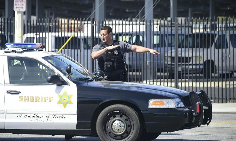 Police man an intersection May 11, 2018 following reports of shooting at Highland High School in Palmdale, 40 miles (65 kilometers) north of downtown Los Angeles. - Police arrested a man after reports of shootings at two schools near Los Angeles, the local sheriff's department and education officials said. The Los Angeles County Sheriff said one suspect had been detained "regarding the person with a gun" at Highland High School. Local news reports had earlier said that at least one person had been wounded. It was not immediately clear what type of weapon the man had. (Photo by Frederic J. BROWN / AFP) (Photo credit should read FREDERIC J. BROWN/AFP via Getty Images)