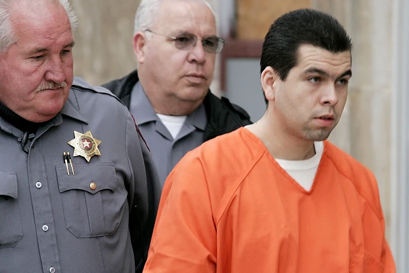 Anthony Sanchez, right, is escorted into a Cleveland County courtroom for a preliminary hearing, Feb. 23, 2005, in Norman, Okla. On Thursday, Sept. 21, 2023, Oklahoma plans to execute Sanchez for the 1996 slaying of a University of Oklahoma dance student in a case that went unsolved for years. Sanchez, 44, is scheduled to receive a lethal injection at 10 a.m. at the Oklahoma State Penitentiary in McAlester, Okla. (Jaconna Aguirre/The Oklahoman via AP, File)