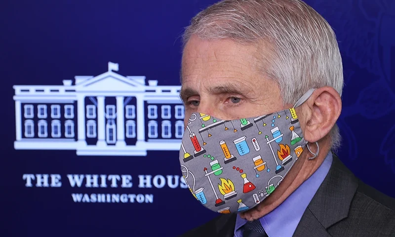WASHINGTON, DC - APRIL 13: National Institute of Allergy and Infectious Diseases Director Dr. Anthony Fauci wears a lab-themed face mask while talking to reporters in the Brady Press Briefing Room at the White House on April 13, 2021 in Washington, DC. Federal health agencies called for a pause in the administration of Johnson & Johnson’s vaccine after six women in the United States developed a rare disorder involving blood clots within about two weeks of vaccination. (Photo by Chip Somodevilla/Getty Images)
