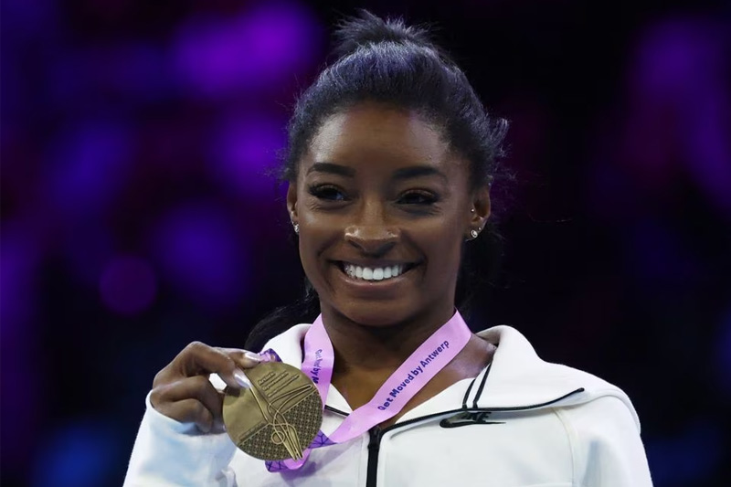 Biles shines, secures two golds on last day at worlds.