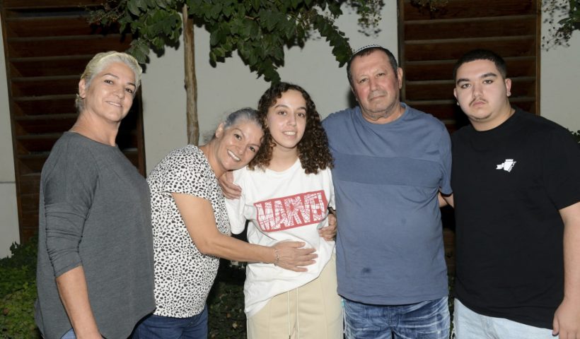 This undated photo provided by the Israeli Security Agency on Monday, Oct. 30, 2023, shows Israeli soldier Pvt. Ori Megidish, center, with relatives. On Monday, the Israeli army said that Megidish was freed from Hamas captivity during Israel's ground offensive in the Gaza Strip. Megidish was among over 230 people taken hostage in Hamas' bloody Oct. 7 cross-border raid. (Israeli Security Agency via AP)