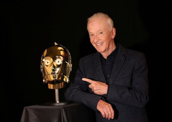 British actor Anthony Daniels, the voice and body of Star Wars droid C-P30,poses next to the head of C-P30. Photo by Reuters.