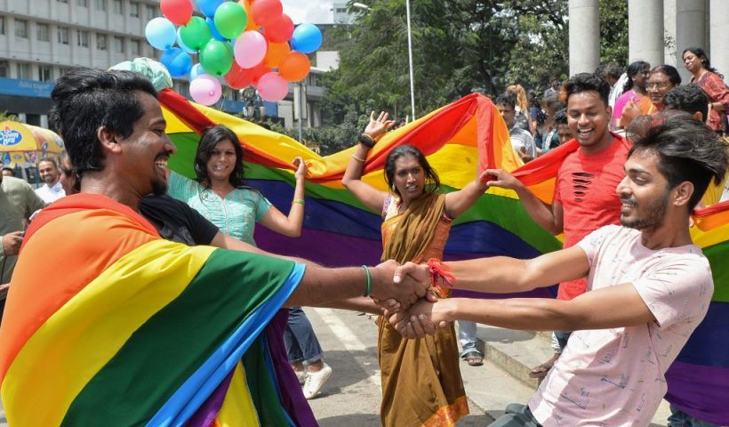 TOPSHOT - Indian members and supporters of the lesbian, gay, bisexual, transgender (LGBT) community celebrate the Supreme Court decision to strike down a colonial-era ban on gay sex, in Bangalore on September 6, 2018. - India's Supreme Court on September 6 struck down the ban that has been at the centre of years of legal battles. "The law had become a weapon for harassment for the LGBT community," Chief Justice Dipak Misra said as he announced the landmark verdict. (Photo by MANJUNATH KIRAN / AFP) (Photo by MANJUNATH KIRAN/AFP via Getty Images)