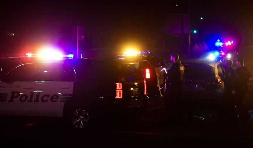 TOPSHOT - Police officers are seen at the intersection of US 101 freeway and the Moorpark Rad exit as police vehicles close off the area responding to a shooting at a bar in Thousand Oaks, California on November 8, 2018. - Twelve people, including a police sergeant, were shot dead in a shooting at a nighttclub close to Los Angeles, police said Thursday. All the victims were killed inside the bar in the suburb of Thousand Oaks late on Wednesday, including the officer who had been called to the scene, Sheriff Geoff Dean told reporters. The gunman was also dead at the scene, Dean added. The bar was hosting a college country music night. (Photo by Frederic J. BROWN / AFP) (Photo credit should read FREDERIC J. BROWN/AFP via Getty Images)