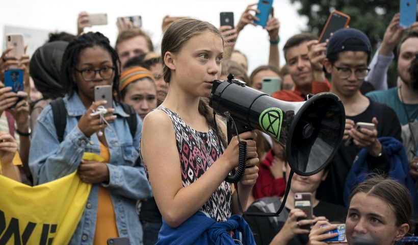 WASHINGTON, DC - SEPTEMBER 13: Teenage Swedish climate activist Greta Thunberg delivers brief remarks surrounded by other student environmental advocates during a strike to demand action be taken on climate change outside the White House on September 13, 2019 in Washington, DC. The strike is part of Thunberg's six day visit to Washington ahead of the Global Climate Strike scheduled for September 20. (Photo by Sarah Silbiger/Getty Images)