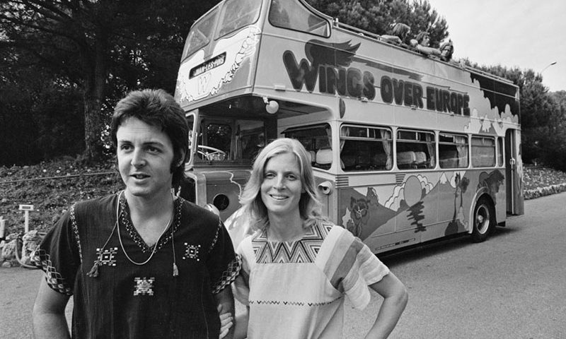 British singer and musician Paul McCartney and American photographer and musician Linda McCartney (1941-1998) in front of the converted bus in which their band Wings are touring Europe, in Juan-les-Pins, France, 12th July 1972. (Photo by Reg Lancaster/Daily Express/Hulton Archive/Getty Images)