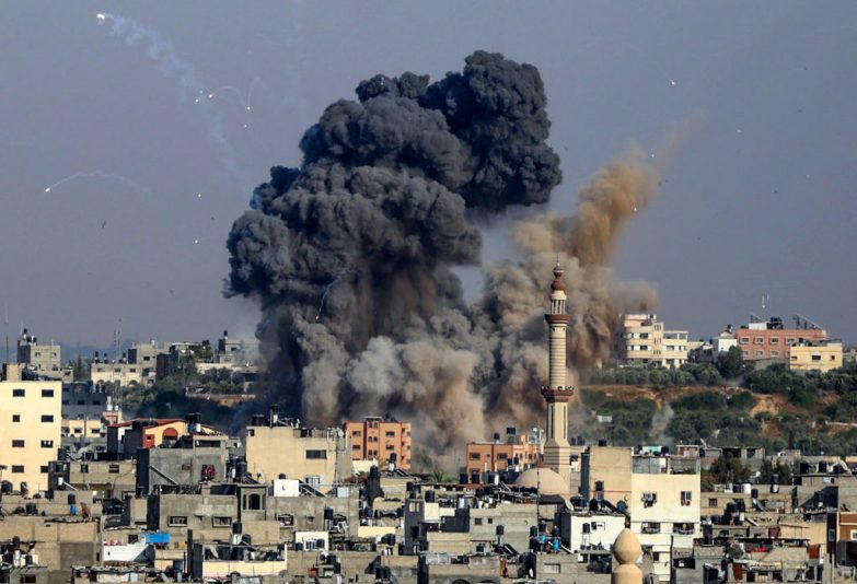 TOPSHOT - Smoke billows from Israeli air strikes in Gaza City, controlled by the Palestinian Hamas movement, on May 11, 2021. - Israel and the Islamist movement Hamas in Gaza exchanged heavy fire, killing at least 26 Palestinians and two Israelis, in an escalation sparked by violent unrest at Jerusalem's flashpoint Al-Aqsa Mosque compound. (Photo by ANAS BABA / AFP) (Photo by ANAS BABA/AFP via Getty Images)
